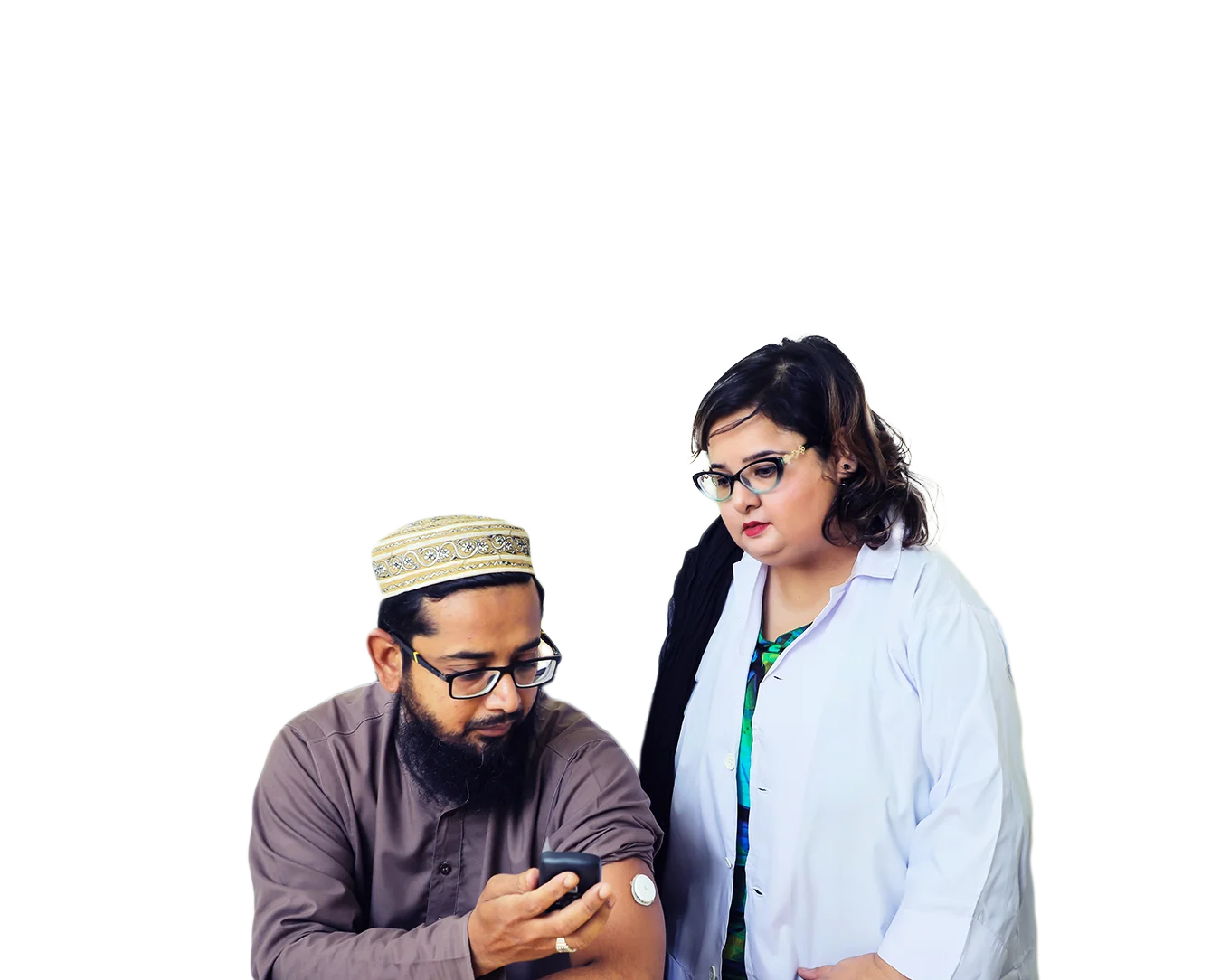 Man checking his blood sugar with woman standing beside him.