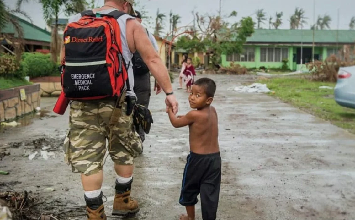 Direct Relief assisting a child following a natural disaster