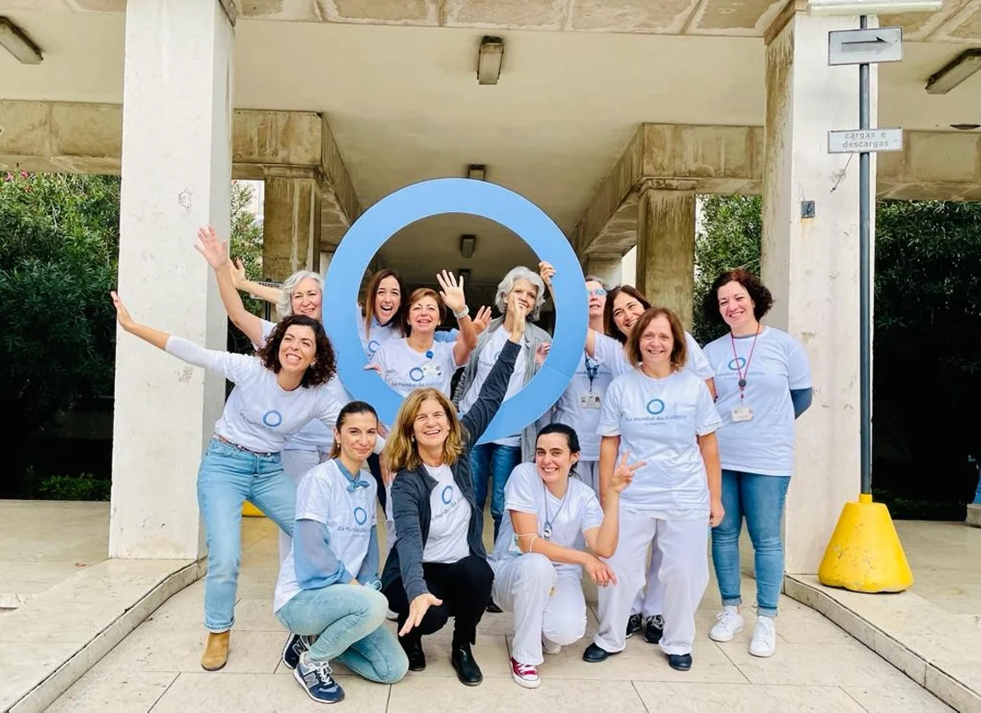 healthcare professionals standing with a giant blue circle
